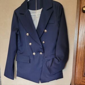 Impressive Navy Blazer with flap pockets and silver buttons.